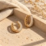 Crystal Pavé Oval Hoop Earrings styled on a display