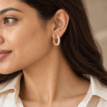 Crystal Pavé Oval Hoop Earrings worn by a model