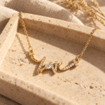 Crystal Script Necklace styled on a display