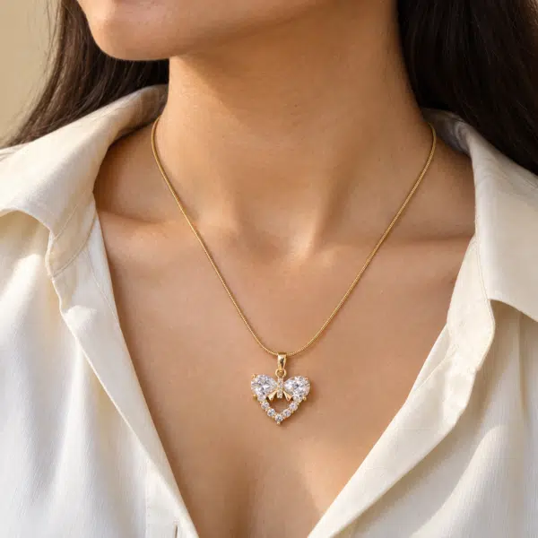 Amore Bow Heart Necklace worn by a model
