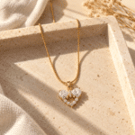 Amore Bow Heart Necklace styled on a display