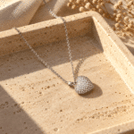 Silver-Tone Pavé Heart Necklace styled on a display