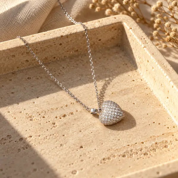 Silver-Tone Pavé Heart Necklace styled on a display