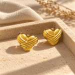 Crossed Ribbon Heart Studs styled on a display