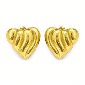 Pair of glossy gold heart earrings isolated on white