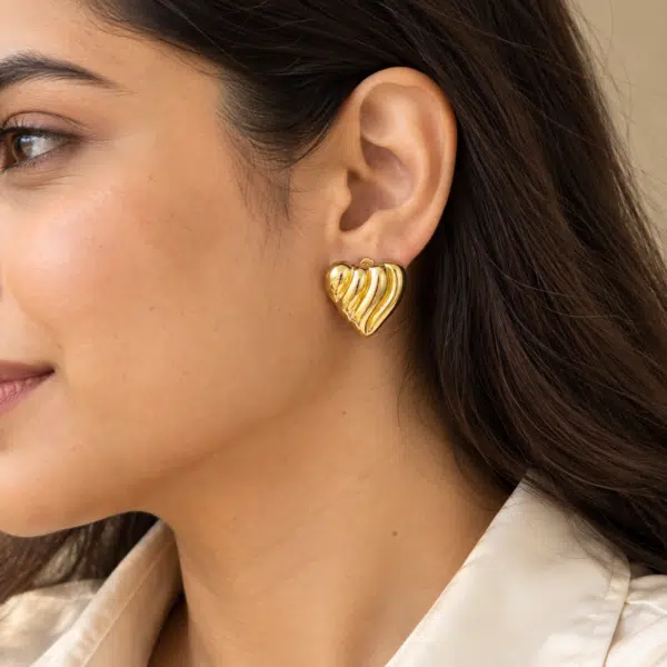 Ribbed Puffed Heart Studs worn by a model