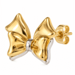 Close-up of a gold plated bow stud earring showing the metal texture