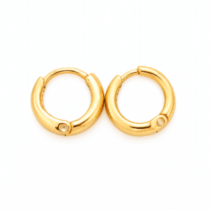 A pair of polished gold hoop earrings on a white background