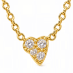 Macro view of heart shaped pendant with sparkling stones
