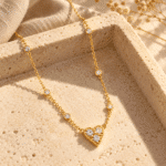 Close up of gold plated Aura Heart Stone Necklace with crystal details