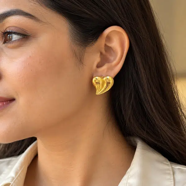 Swirl Heart Studs worn by a model