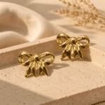 Polished Bow Studs styled on a display