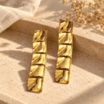 Pair of sculptural Aura Square Gold Plated Earrings featuring polished textured tiles