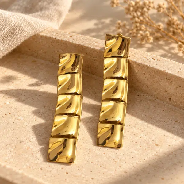Pair of sculptural Aura Square Gold Plated Earrings featuring polished textured tiles