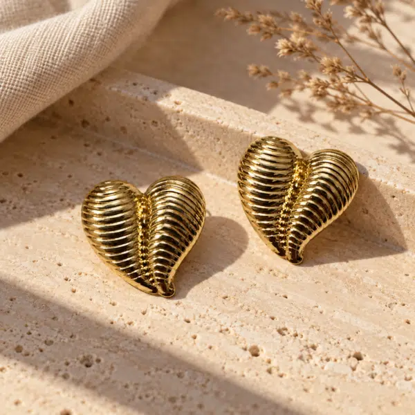 Ribbed Heart Studs styled on a display