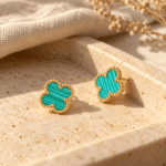 Azure Clover Gold Earrings styled on a display
