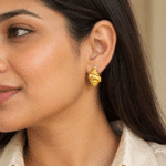 Conch Shell Gold Earrings worn by a model