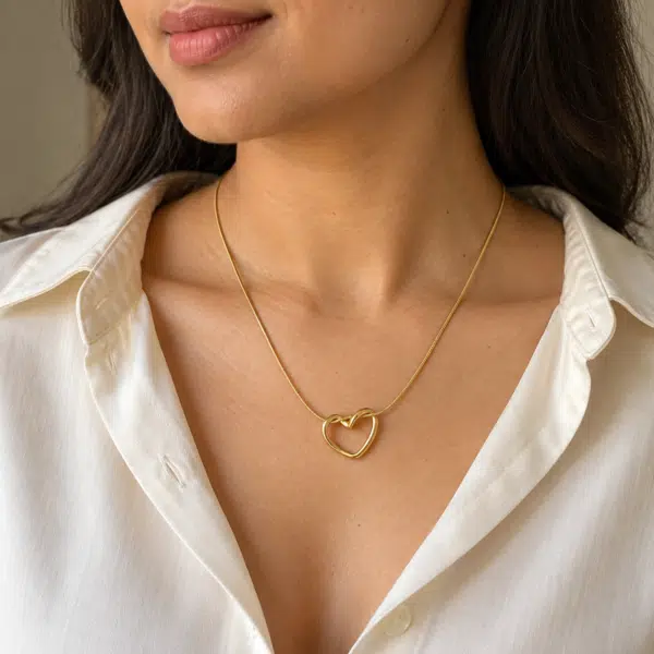 Elowyn Gold Heart Necklace worn by a model
