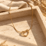Elowyn Gold Heart Necklace styled on a display
