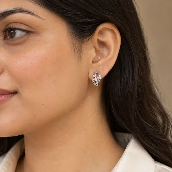 Filigree Oval Silver-Tone Earrings worn by a model