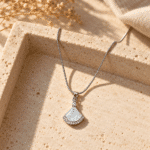 Silver-Tone Fan Pendant Necklace styled on a display