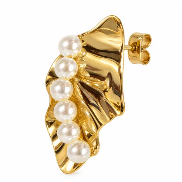 Side view of a single gold and pearl earring