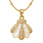 Detailed close up of mother of pearl shell pendant with clear stones