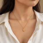 Close-up of the Maris Gold Starfish Necklace worn on a neck