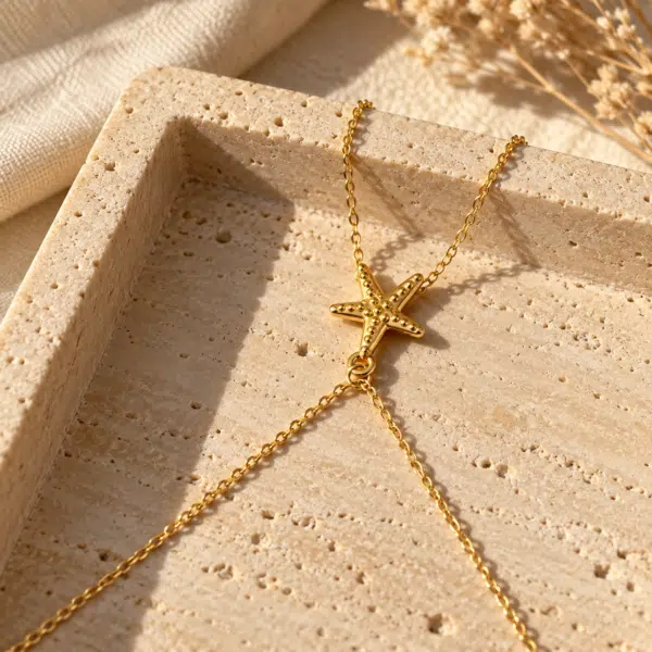 Golden starfish pendant on a delicate chain