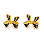 A pair of elegant black enamel bow gold plated earrings on a white background