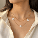 Woman wearing a delicate floral layered gold necklace