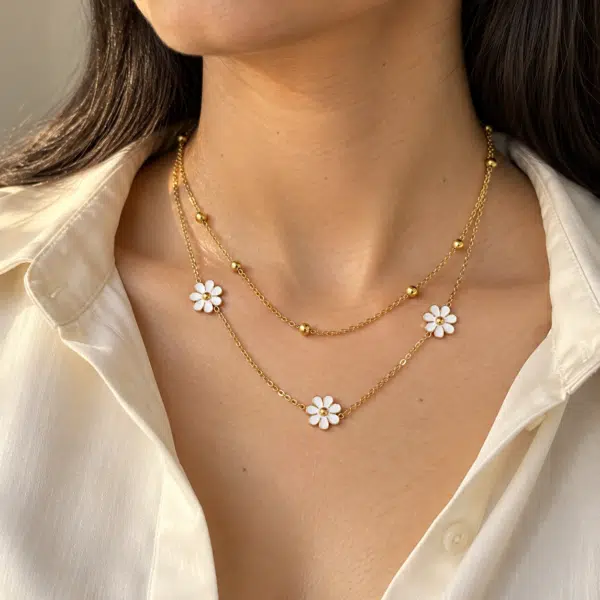 Woman wearing a delicate floral layered gold necklace