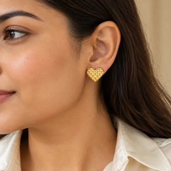 Quilted Heart Studs worn by a model