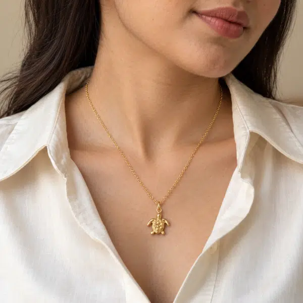 Serene Turtle Gold Necklace worn by a model