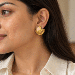 Wave Shell Gold Studs worn by a model