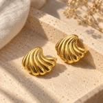 Wave Shell Gold Studs styled on a display