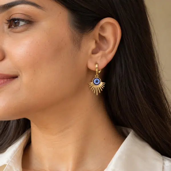 Solar Evil Eye Drop Hoops worn by a model
