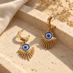 Solar Evil Eye Drop Hoops styled on a display
