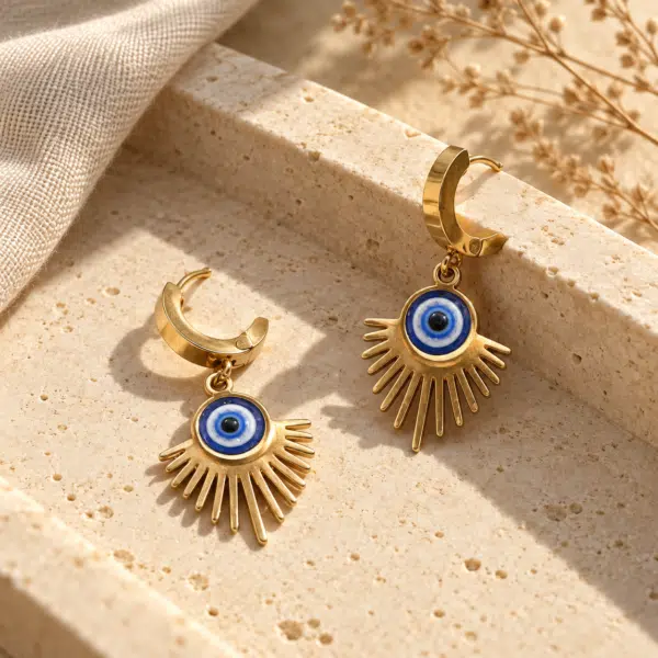 Solar Evil Eye Drop Hoops styled on a display