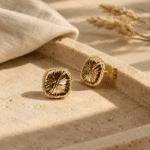 Solaris Gold Studs styled on a display
