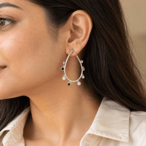 Model wearing minimalist drop crystal hoop earrings