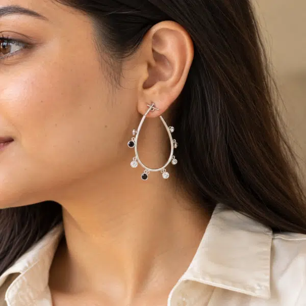 Teardrop Charm Hoop Earrings worn by a model