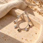 Teardrop Charm Hoop Earrings styled on a display
