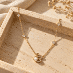 Swan Lake Gold Pearl Necklace styled on a display