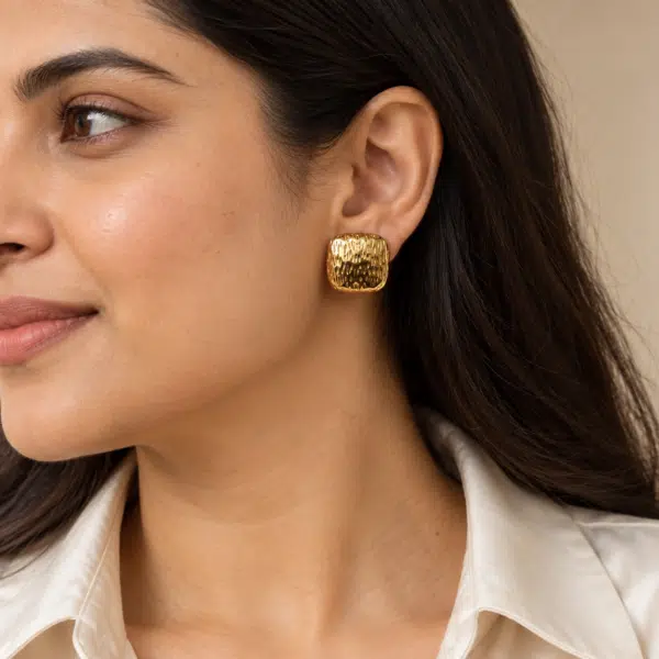 Textured Gold Stud Earrings worn by a model