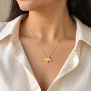 Model wearing a gold plated pendant necklace