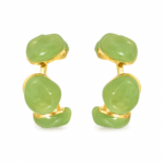 Front view of green resin hoop earrings on white background